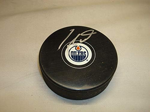 Taylor Hall assinou o Edmonton Oilers Hockey Puck autografado 1a - Pucks autografados da NHL