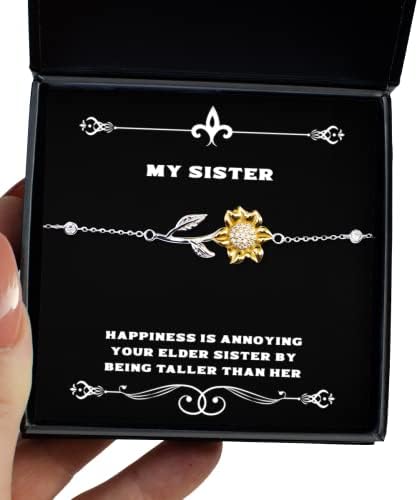 A felicidade está irritando sua irmã mais velha por ser mais alta do que sua pulseira de girassol, irmã presente da irmã, sarcástica