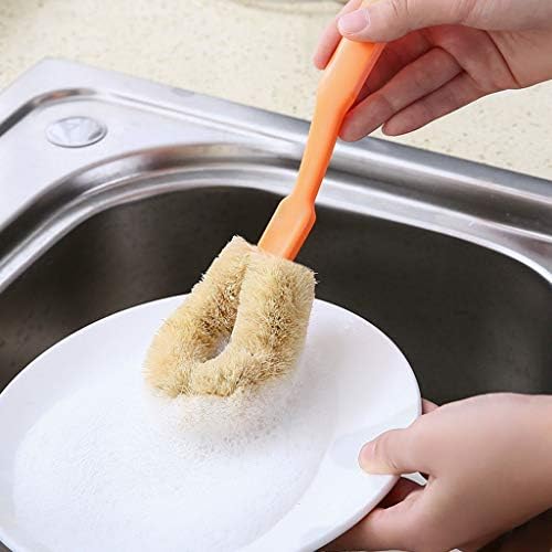 Óleo antiaderente, sem mãos sujas lavando a escova de escova com maçane