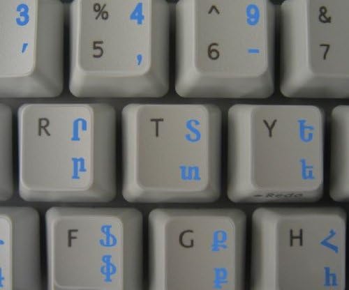 Decalques do teclado armênio em fundo transparente com letras azuis, pretas, verdes, vermelhas, brancas ou amarelas