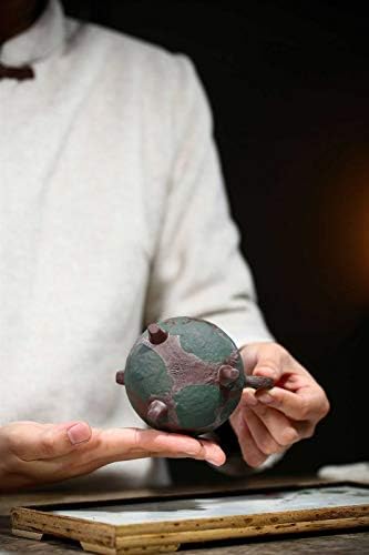 bule de barro roxo bule de chá, um famoso bule de tripé de lama roxa de lama de lama bruta feita à mão, feita à mão