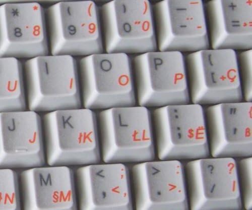 Adesivos de teclado albaneses em fundo transparente com letras laranja